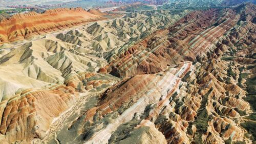 Video - Aerial drone view of eroded sandstone ridges in Zhangye Danxia National Geopark, Gansu, China