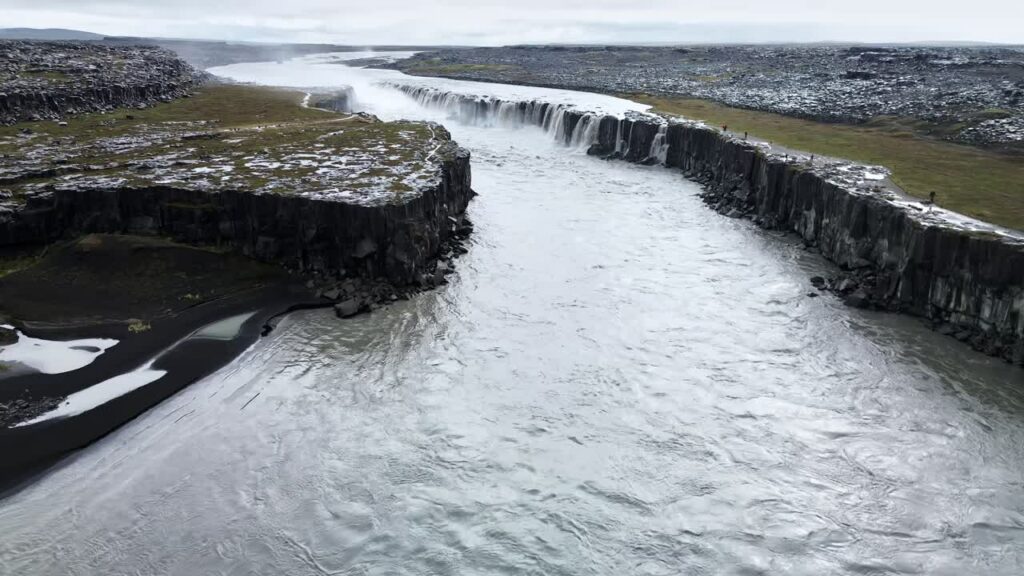 Video - Aerial drone view of Dettifoss waterfall along the Jokulsa a Fjollum river in North Iceland