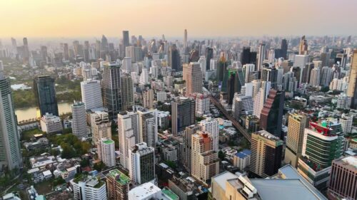 Video - Aerial drone view of the Bangkok skyline with modern skyscrapers and dense urban cityscape stretching across the horizon in Thailand Bangkok, Thailand - June, 6, 2025: