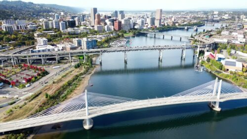 Video - Aerial drone view of downtown Portland skyline and multiple bridges crossing the Willamette River in Oregon, USA