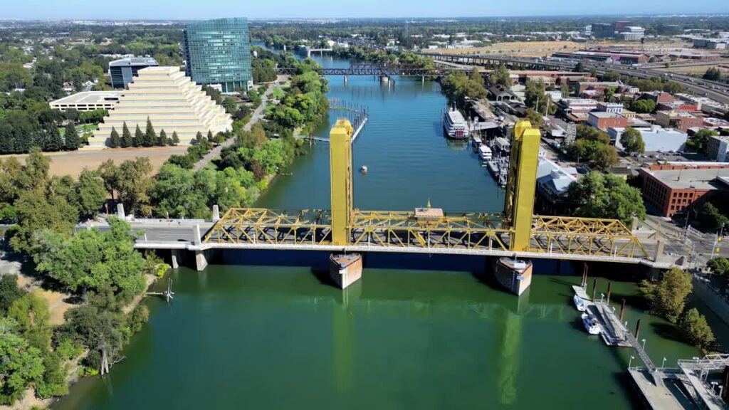 Video - Aerial drone view of the historic Tower Bridge crossing the Sacramento River in downtown Sacramento, California