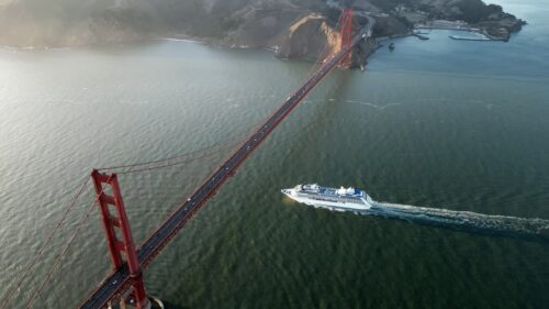 Video - Aerial drone view of a passenger boat passing under the Golden Gate Bridge in San Francisco Bay