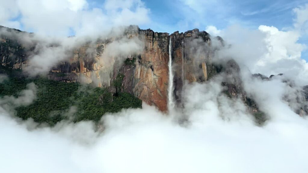 Video - Aerial drone view of Angel Falls cascading from the Auyan tepui mountain in Canaima National Park, Venezuela, the tallest waterfall in the world