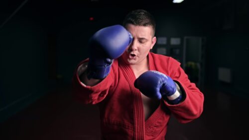 Video - Taekwondo in red kimono boxing